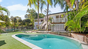 A modern family home in Noosa Heads with a large pool and garden, secured by Noosa Heads buyers agent for a successful interstate relocation.