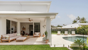 outdoor entertaining area of family home showcasing stunning tropical pool and patio